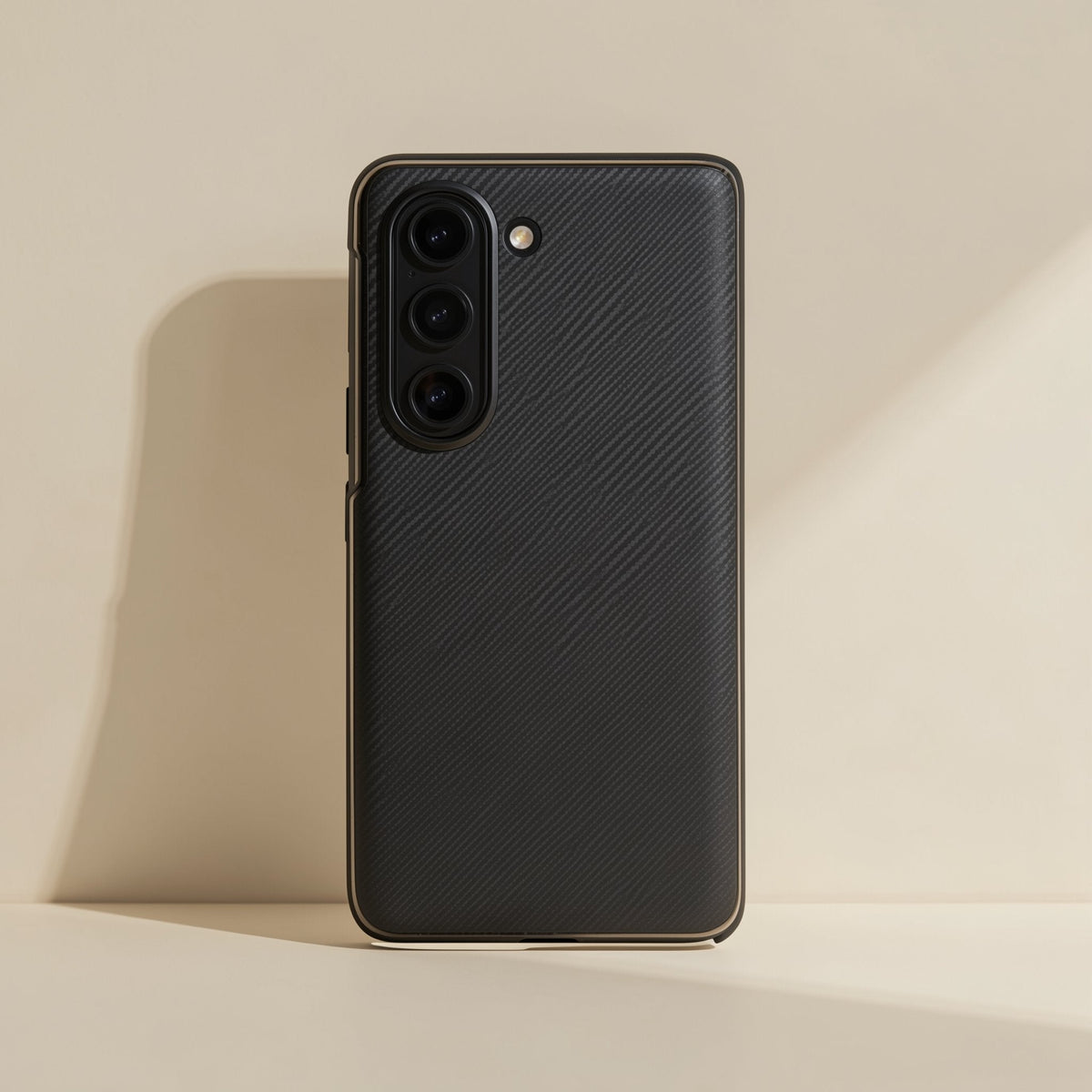 Flipgrain Leather Magnetic Flip Phone Case in black, rear view standing against a cream wall with soft shadow