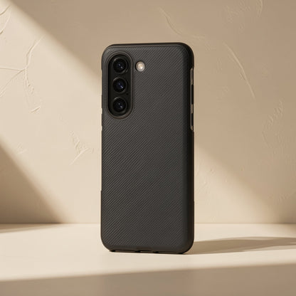 Flipgrain – Black textured case at a three-quarter angle showing side button cutouts and triple camera ring