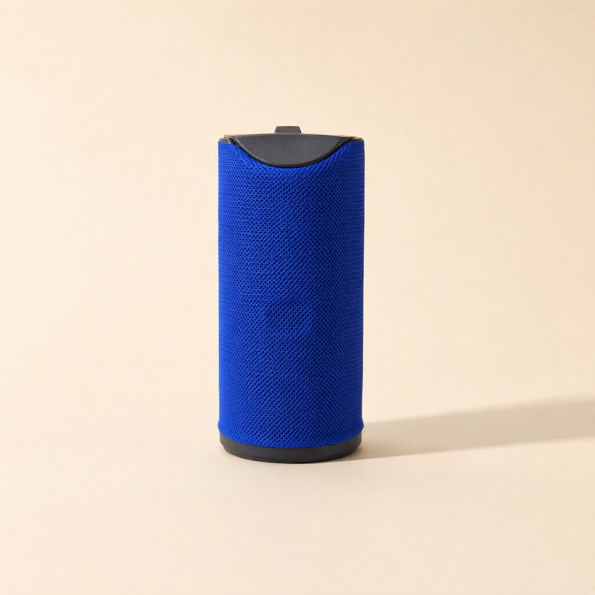 Tuneclip Portable Bluetooth Speaker in blue, front view with black top cap on a cream background