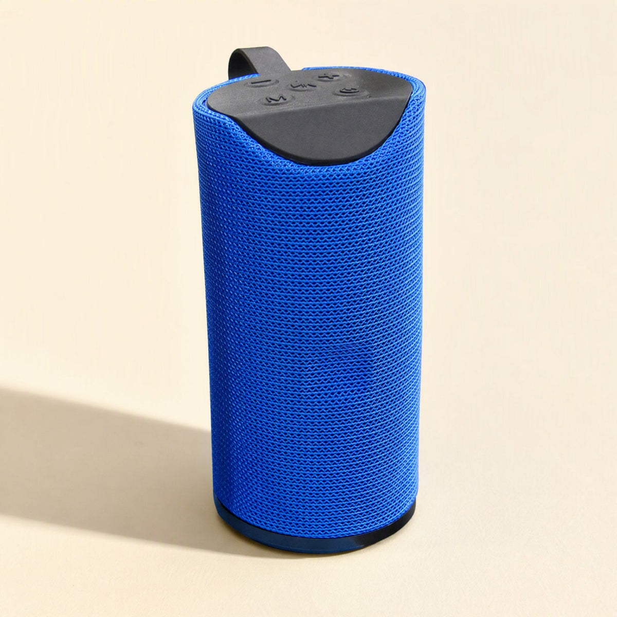 Tuneclip – Blue cylindrical speaker seen from above at an angle, showing black top panel with buttons and carry strap