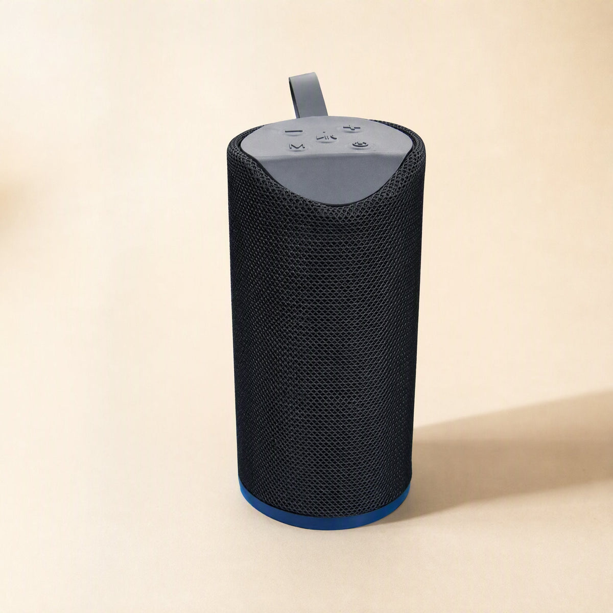 Tuneclip – Black mesh-covered speaker with grey top control panel, strap and blue base ring on a beige background