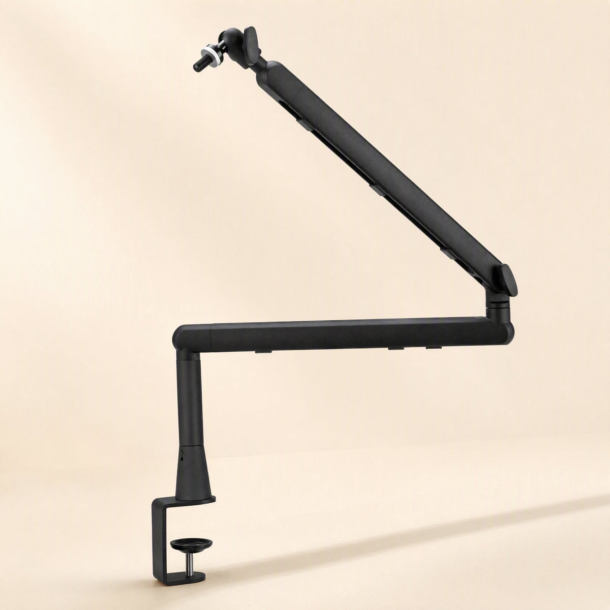 Swingreach – Bracket arm raised diagonally upward from its desk clamp, with no microphone attached