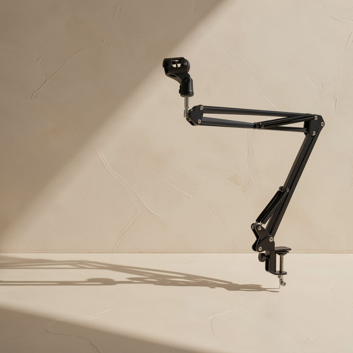 Clipgrip Microphone Bracket With Clip, a black boom arm with clamp, shown in full against a cream wall