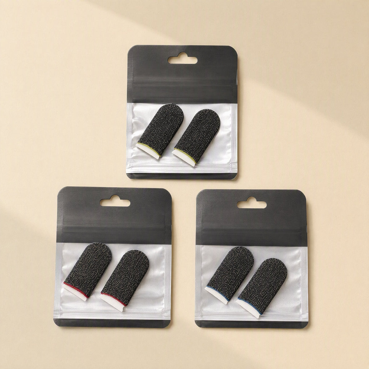 Gamegrip Touchscreen Finger Sleeve – three packs of black sleeves with white, red and blue edging in clear hanging bags