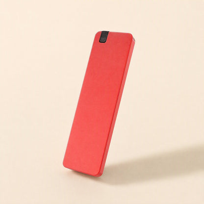 Solidvault Portable SSD – red metal portable drive standing upright on its short edge against a cream background
