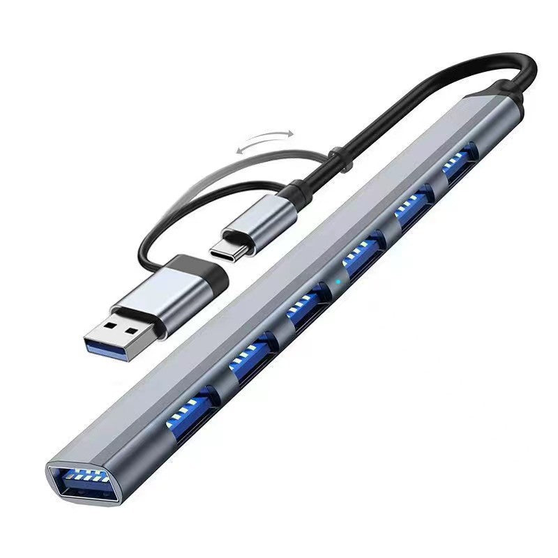 Portalum USB 3.0 Hub – slim gray aluminum seven-port hub with a swivel dual Type-C and USB-A plug, angled view on white