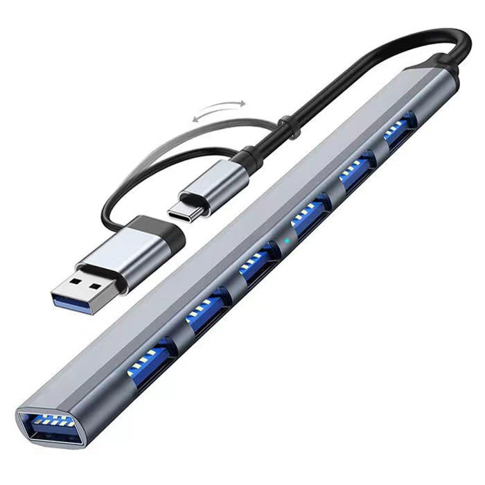 Portalum USB 3.0 Hub – gray hub with seven blue ports and a flip-out Type-C and USB-A dual connector, front-left angle