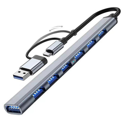 Portalum USB 3.0 Hub – gray hub with seven blue ports and a flip-out Type-C and USB-A dual connector, front-left angle