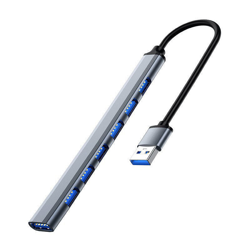 Portalum USB 3.0 Hub – gray seven-port USB hub with a USB-A plug on a black cable, slim aluminum body, angled view