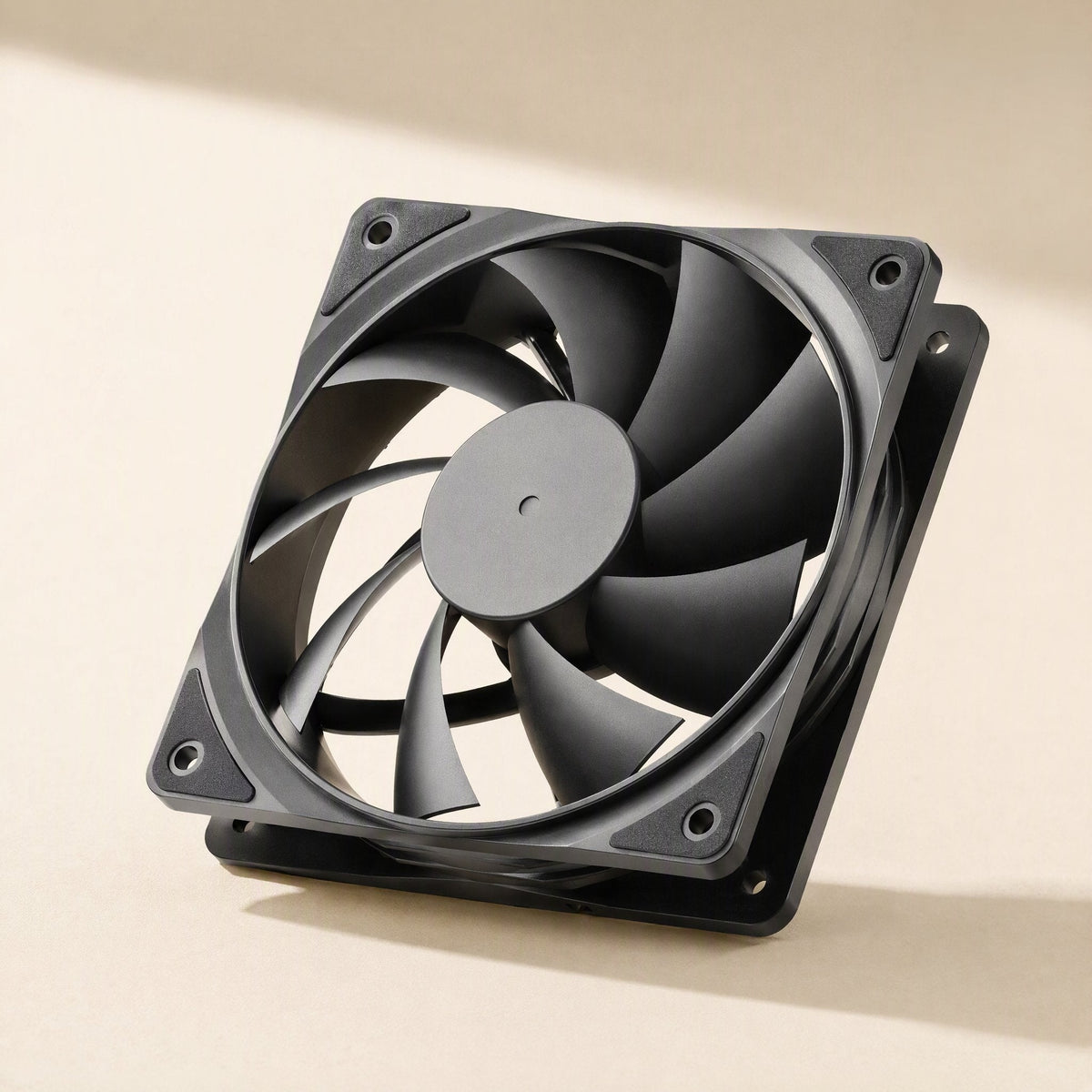 Fanwhisper Desktop Cooling Fan – black ABS fan frame tilted to show the corner screw holes and the thick frame edge