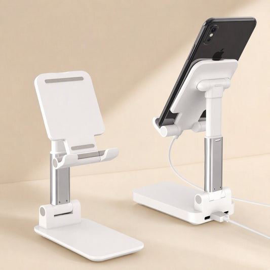 Fliprest – White holder with silver stem, one holding a phone with a charging cable plugged into the base
