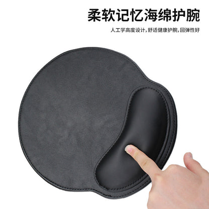 Wristcradle – Finger pressing the cushioned wrist rest of a black leather round mouse pad, with Chinese text above