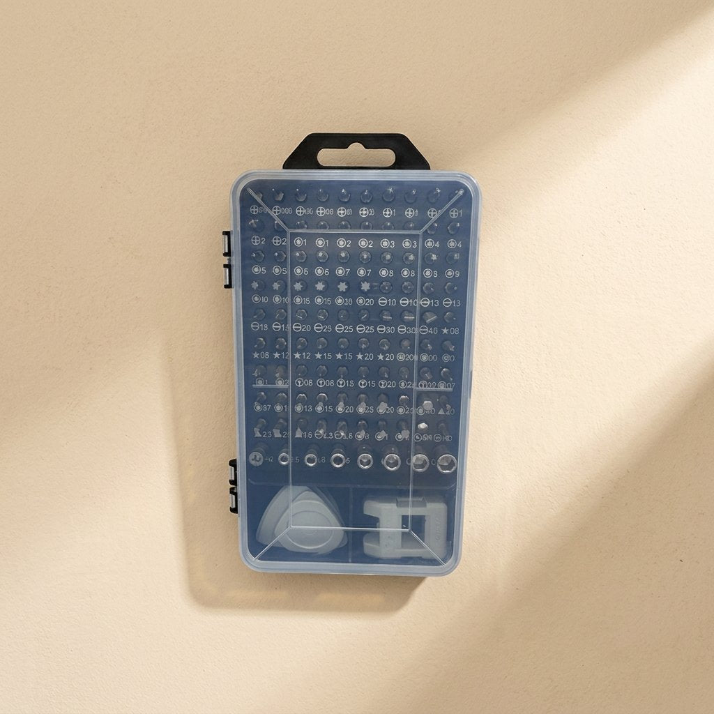 Bitbundle – Closed clear case showing rows of labelled screwdriver bits, pry tool and holder on a beige wall