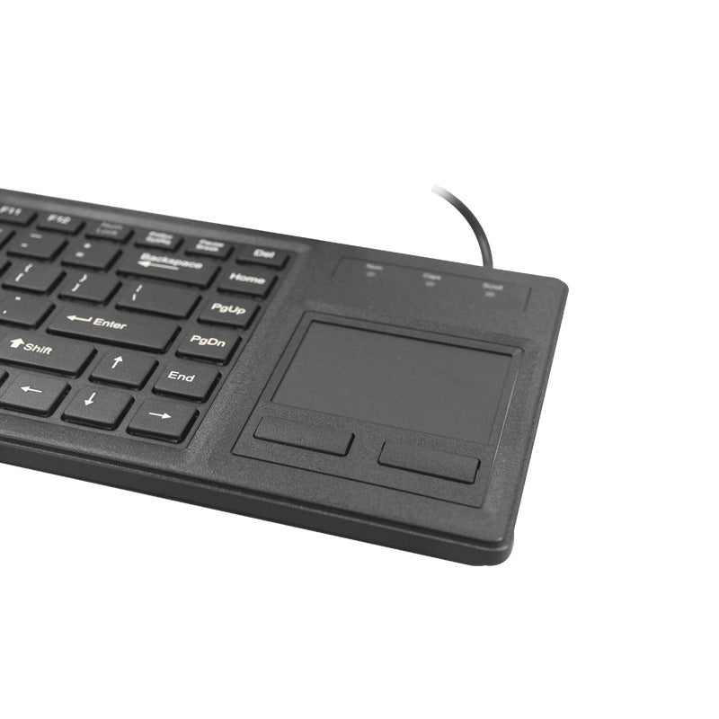 Keytrack – Close-up angled view of the right side showing the touchpad, two buttons and indicator lights