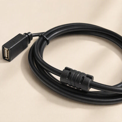 Copperreach USB Extension Cable – close-up of the female USB port end and cylindrical ferrite choke on the coiled black cable