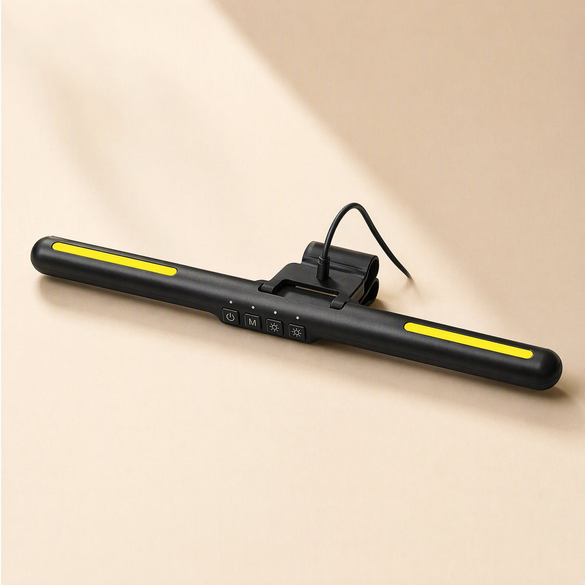 Screenlit – Top view of the lamp bar with yellow light strips, four control buttons and a clip with a cable plugged in