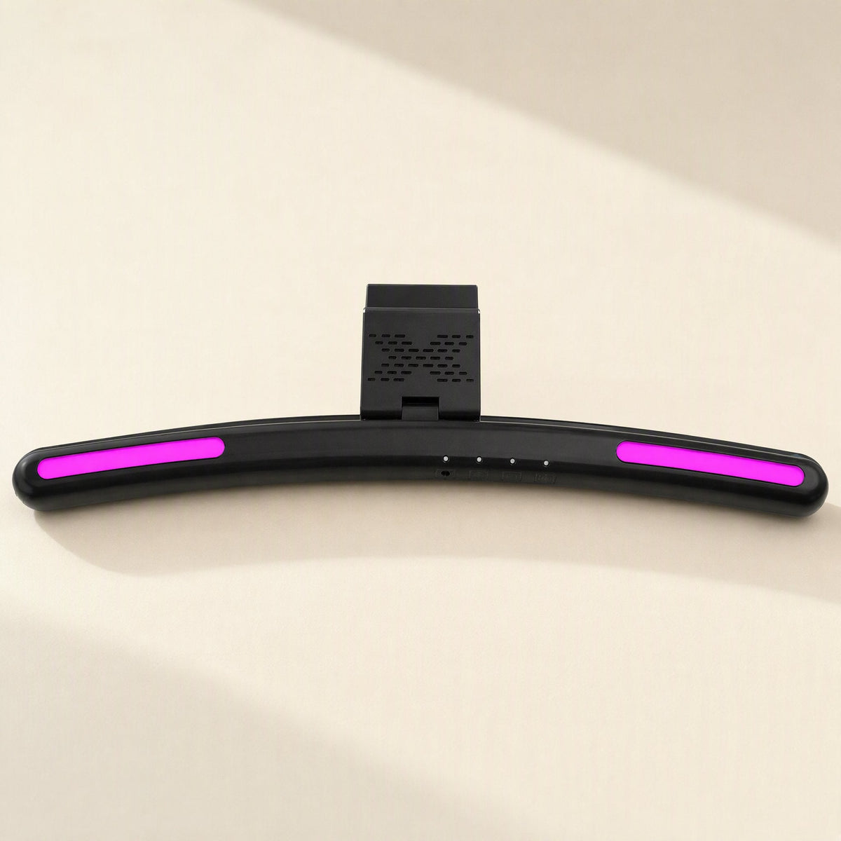 Screenlit – Curved black lamp bar with magenta light strips and a vented mounting clip, viewed from the front