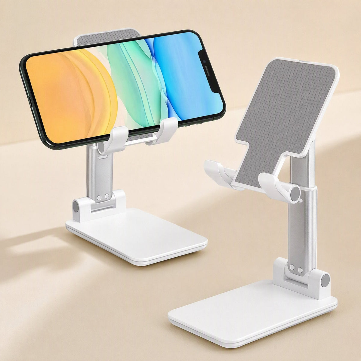Phonehinge – White folding phone bracket holding a smartphone in landscape, next to a second stand seen from behind