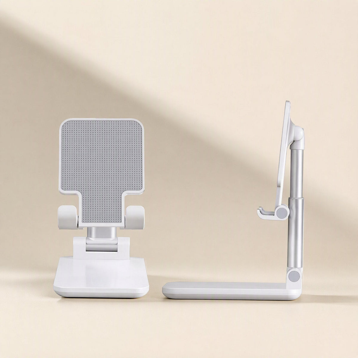 Phonehinge – Front and side views of a white folding phone bracket, showing the grey grip pad and extended arm