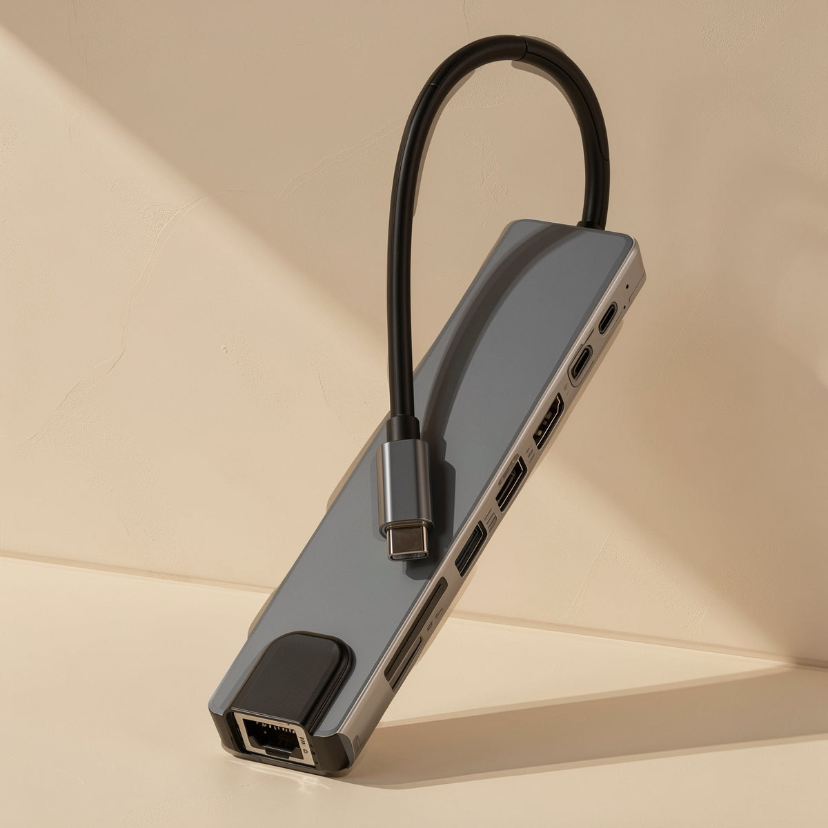 Docknest USB-C Docking Station Hub – grey hub propped upright on its end, showing the Ethernet port and attached USB-C cable