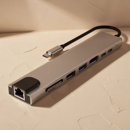 Docknest – Silver hub with attached USB-C cable, angled view highlighting the Ethernet port and SD card slots