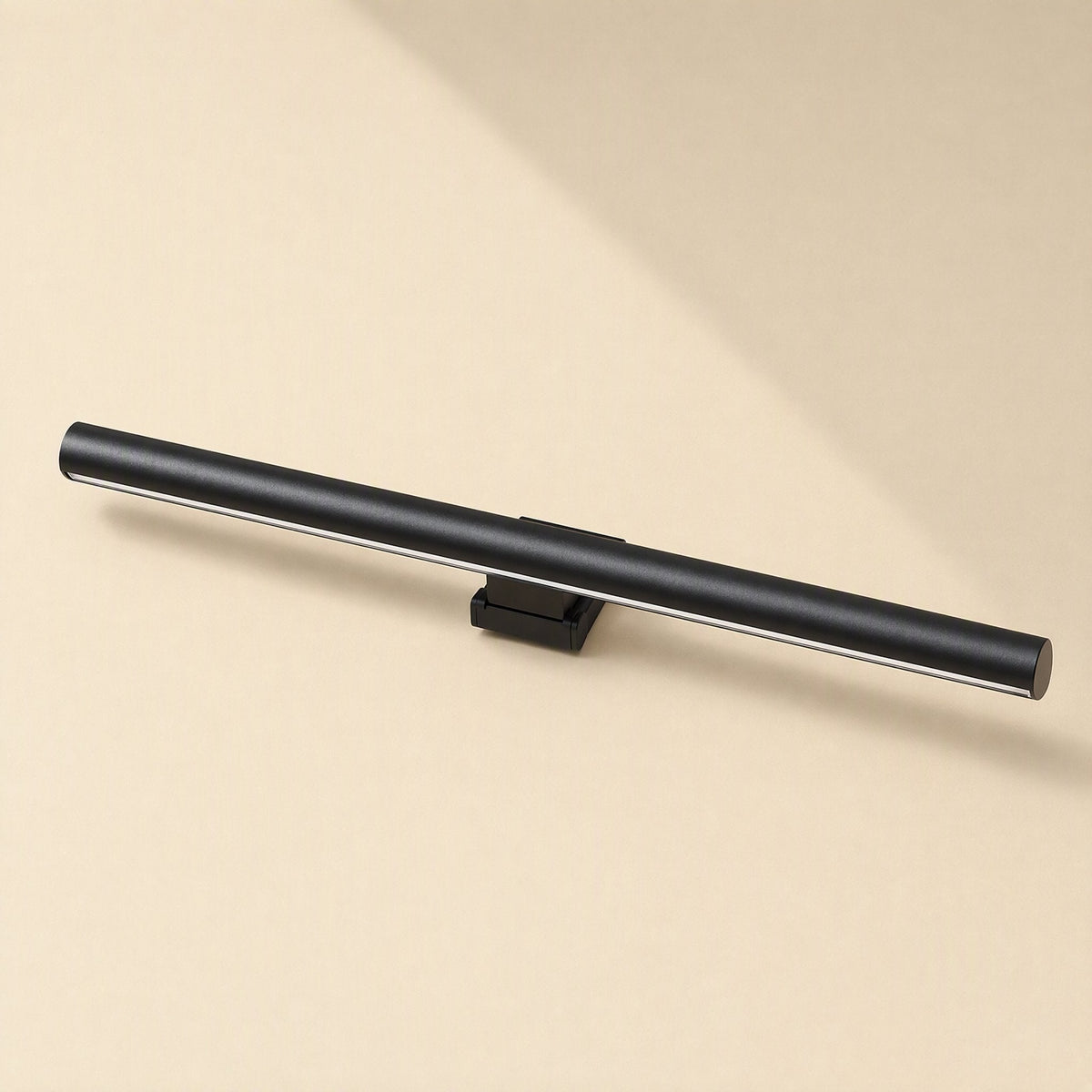 Alulight – Matte black lamp bar seen from the left angle, with its clip mount below on a beige backdrop