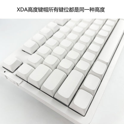 Xdalux – Angled close-up of white blank XDA-profile keycaps in uniform height on a white keyboard