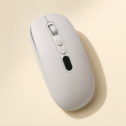 Speakclick – Light grey wireless mouse seen from above at an angle, showing scroll wheel, two buttons and a dark display