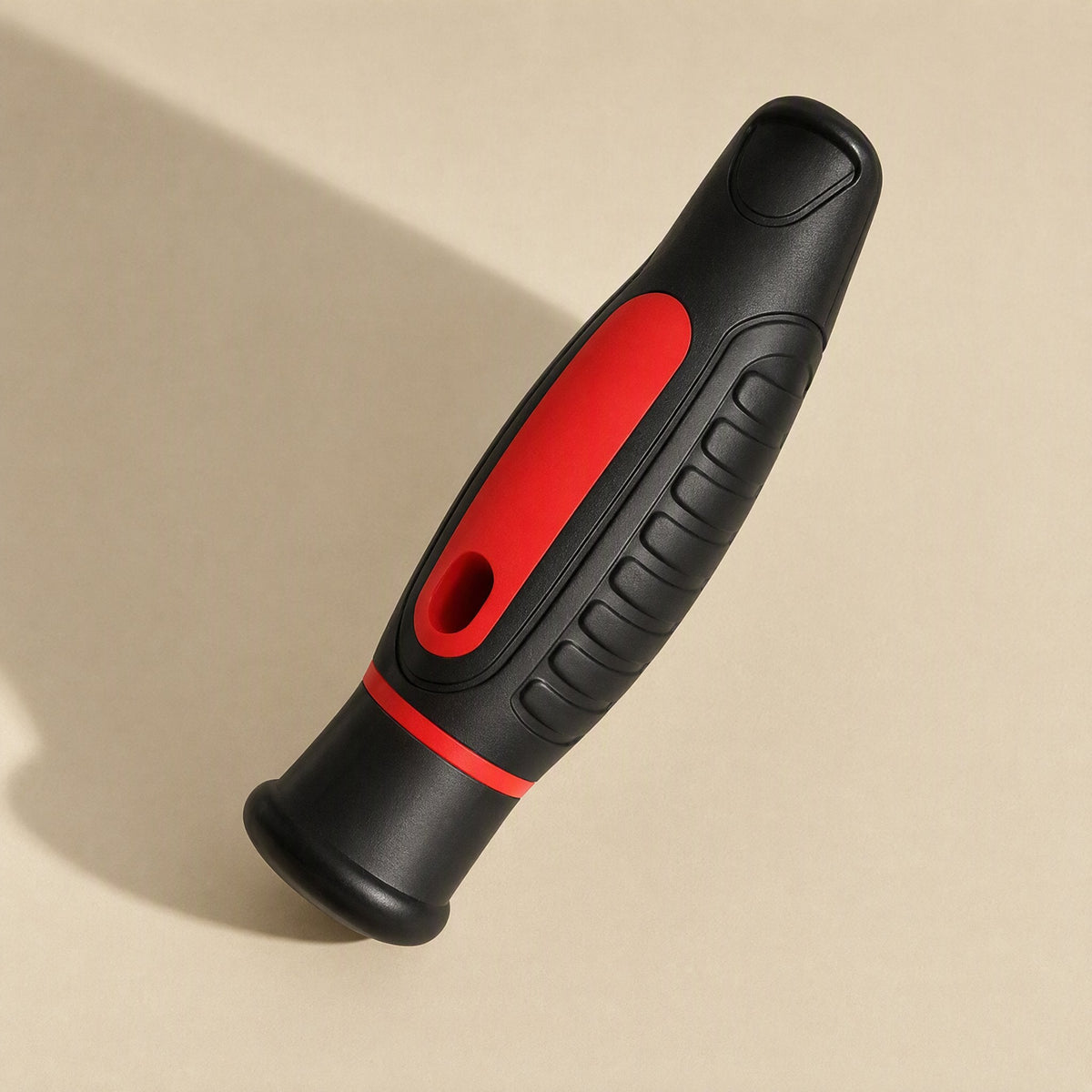 Magnetwist – Close-up of the red and black rubberized grip handle with ribbed finger grooves, shown at an angle