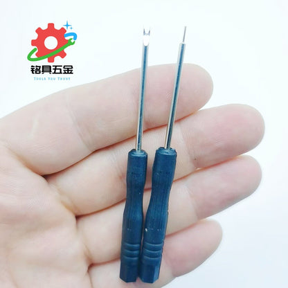 Precisor – Two small blue-handled screwdrivers with a U-shaped and a pin tip held in an open palm