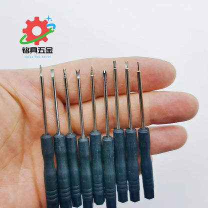 Precisor – Nine small screwdrivers with different tip shapes and blue handles lined up across a hand