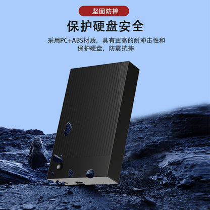 Shellbox – Black ribbed enclosure standing on dark rocks, showing its USB port and power jack on the end