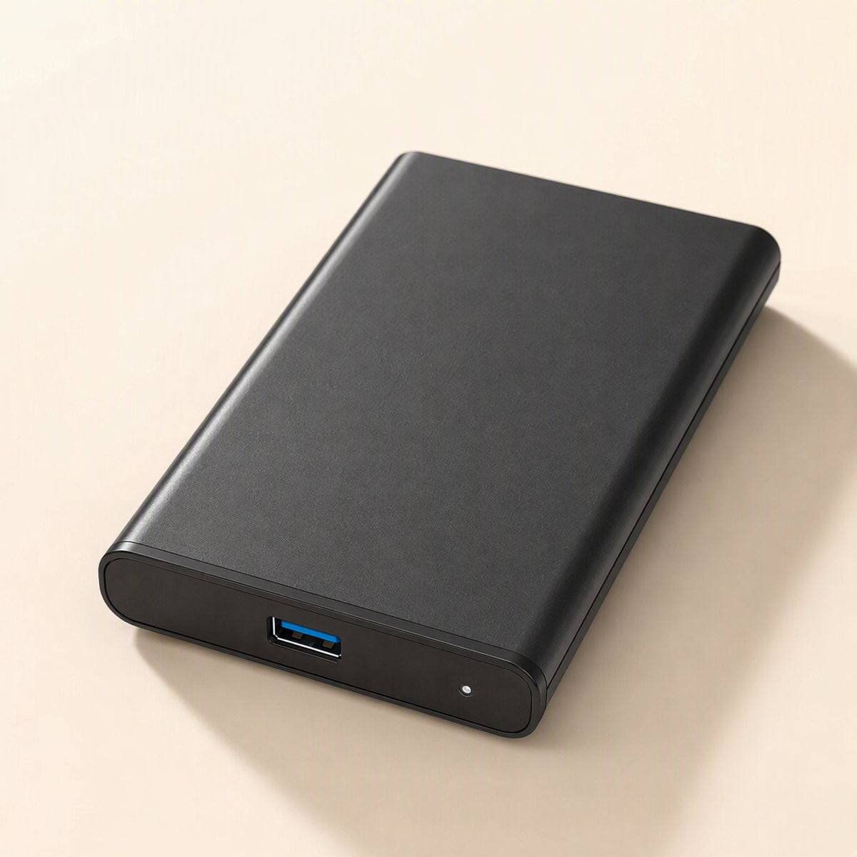 Portshield – Slim black 2.5-inch enclosure lying flat with a blue USB port and small indicator light on the front edge