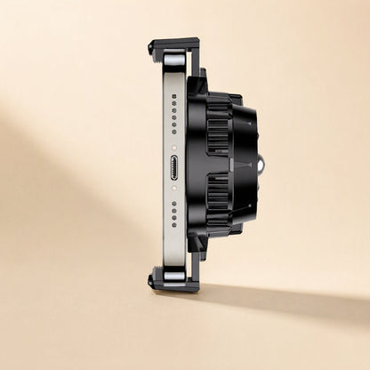 Coolcove – Side view of the radiator gripped on a phone's edge, showing the slim clamps and ribbed vents