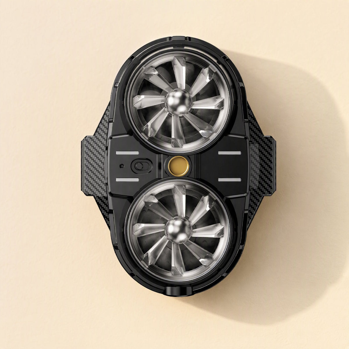Coolcove – Front view of the black radiator with two metallic fans, a gold button and a slide switch at center