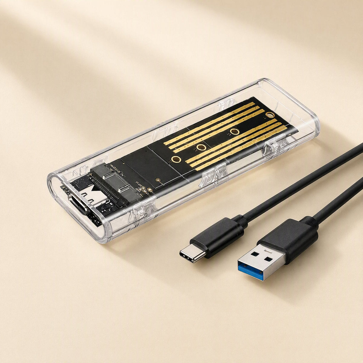 Driveclear M.2 Transparent Hard Drive Box beside a black USB-C to USB-A cable on a cream background