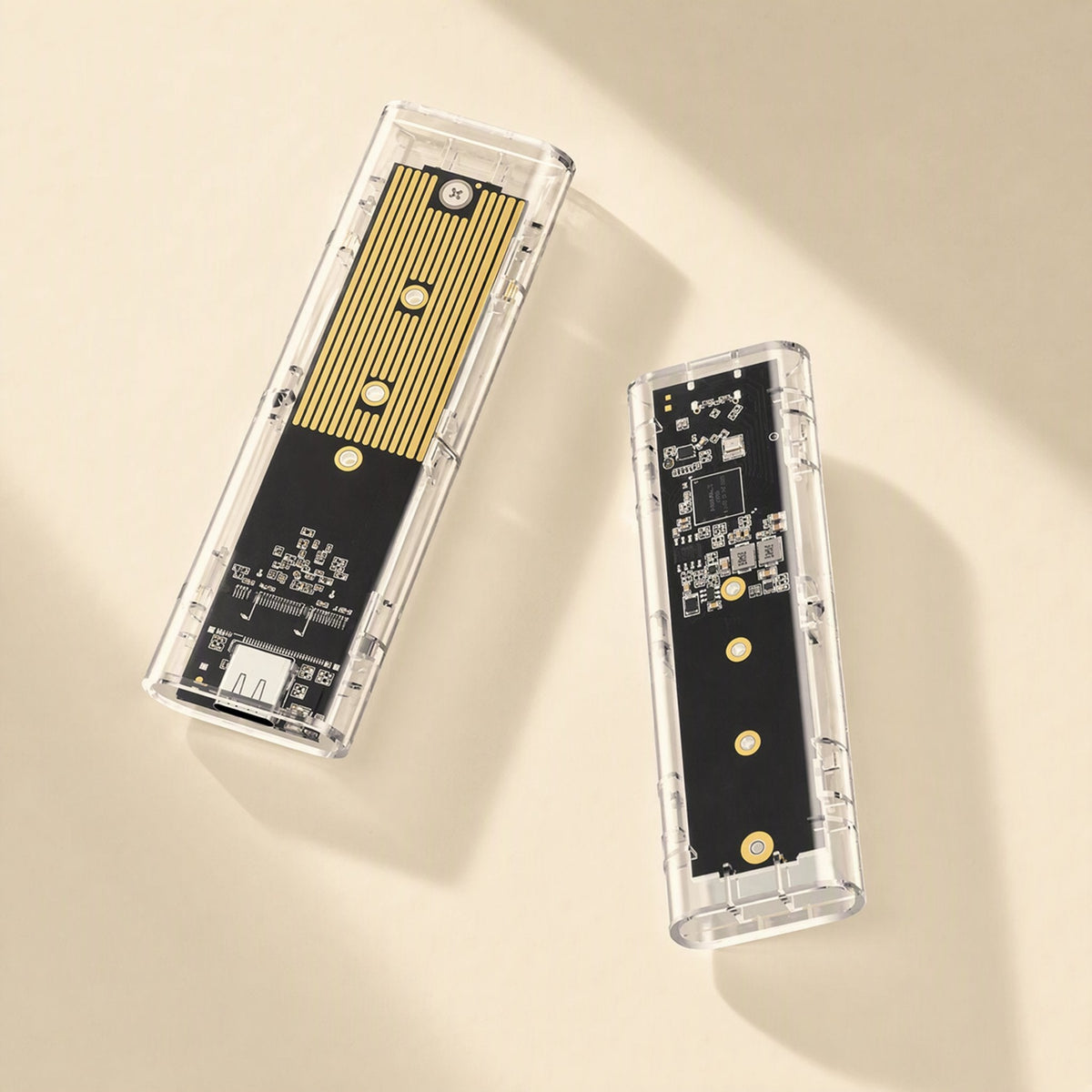 Driveclear – Top-down view of two clear enclosures, one showing the gold heatsink strip, the other the circuit board