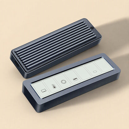 Glowvault – Ribbed gray enclosure beside its open display half showing icon panels, on a beige surface