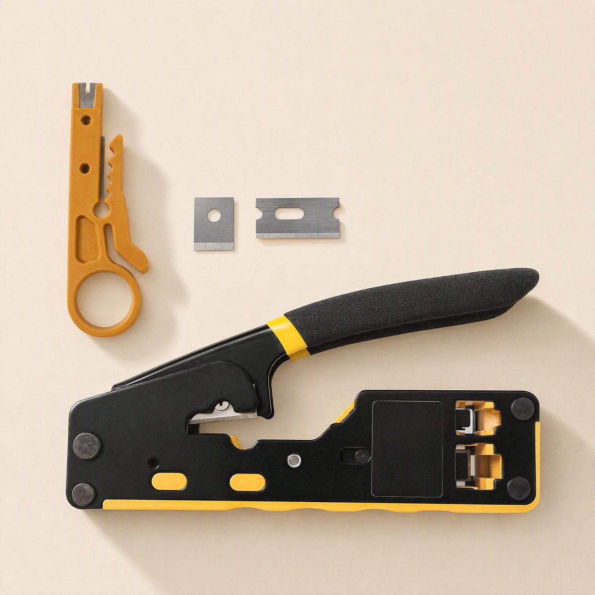 Twinline – Top-down view of the crimper with orange cable stripper and two spare blades on a beige surface