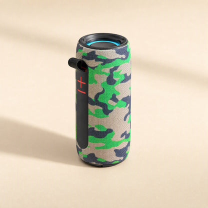 Twinbeat – Green camouflage speaker from a higher angle, with strap, red volume buttons and a blue light ring on top