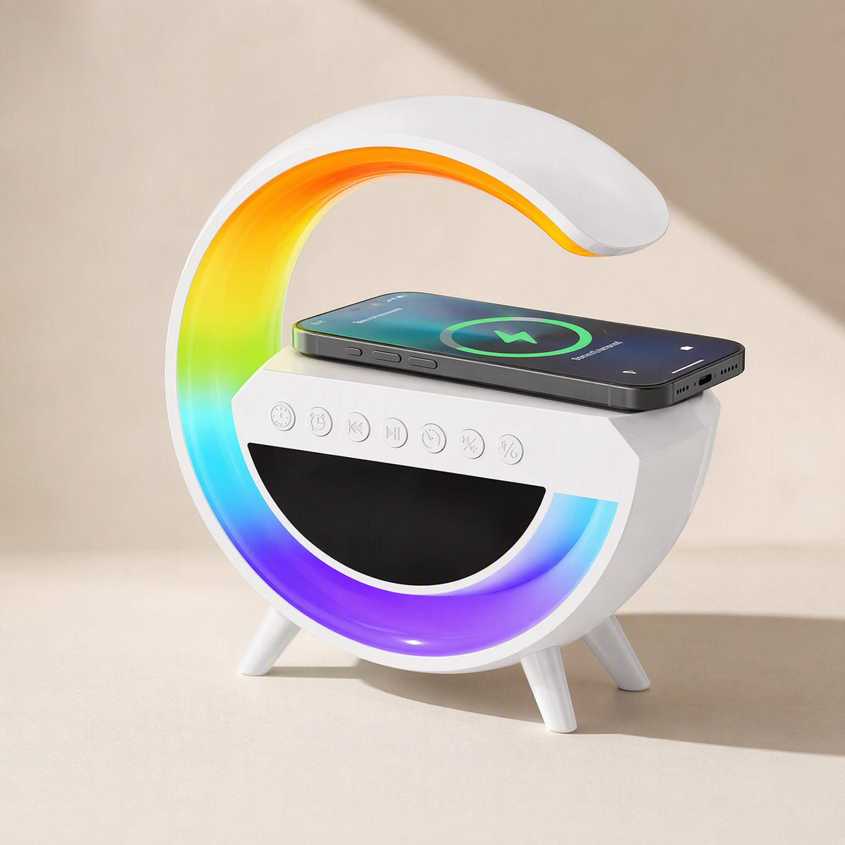 Lightbeat – Smartphone charging on the speaker's top pad beside the glowing rainbow G-shaped light ring