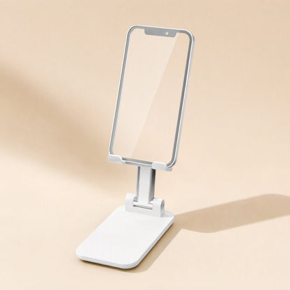 Deskfold – White desktop stand holding a smartphone upright, shown at an angle with a soft shadow on a cream backdrop