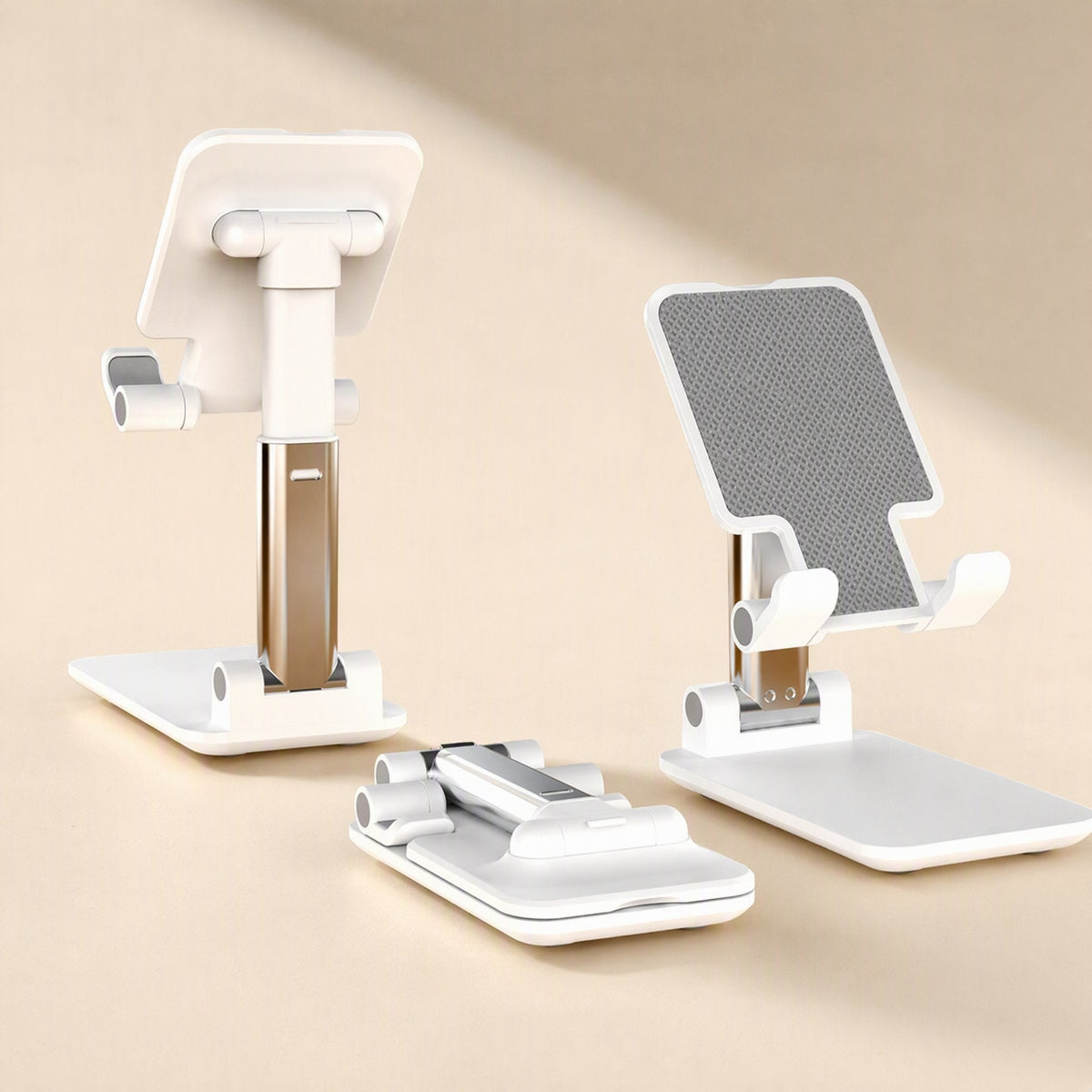 Deskfold – Back and front views of the white stand with its folded base beside it, silver and gold arm visible