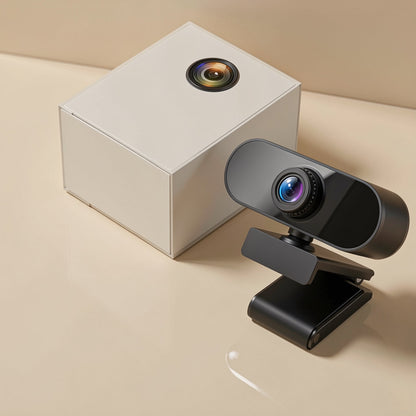 Viewtalk – Black webcam on its clip stand beside a white square box with a lens graphic on a beige surface