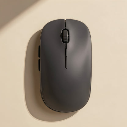 Slimclick Ultra-Thin Bluetooth Wireless Mouse in charcoal gray, top view with side buttons on a cream surface