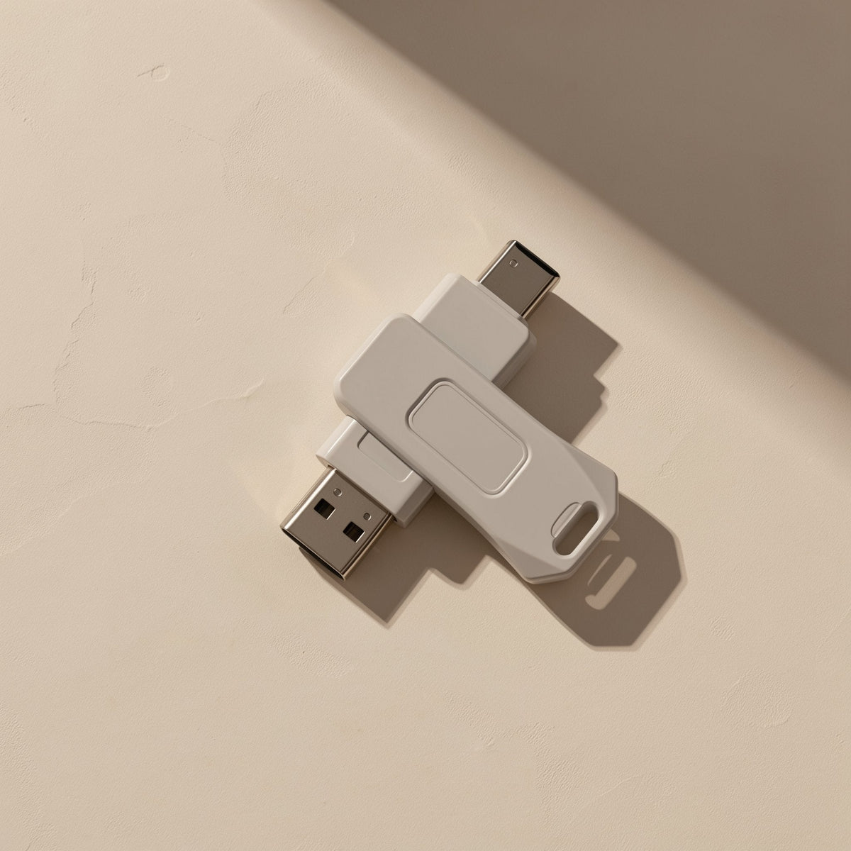 Typeflash Type-C dual-interface flash drive in white, USB-A and USB-C ends splayed on a beige surface