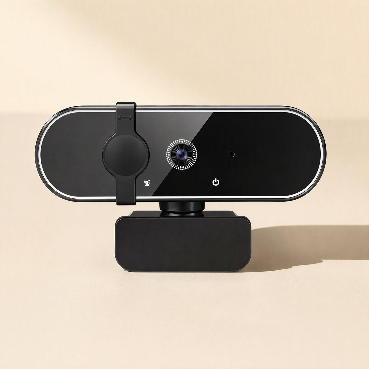 Soundglance USB Computer Camera, front view with sliding privacy cover closed over the lens, on a peach backdrop