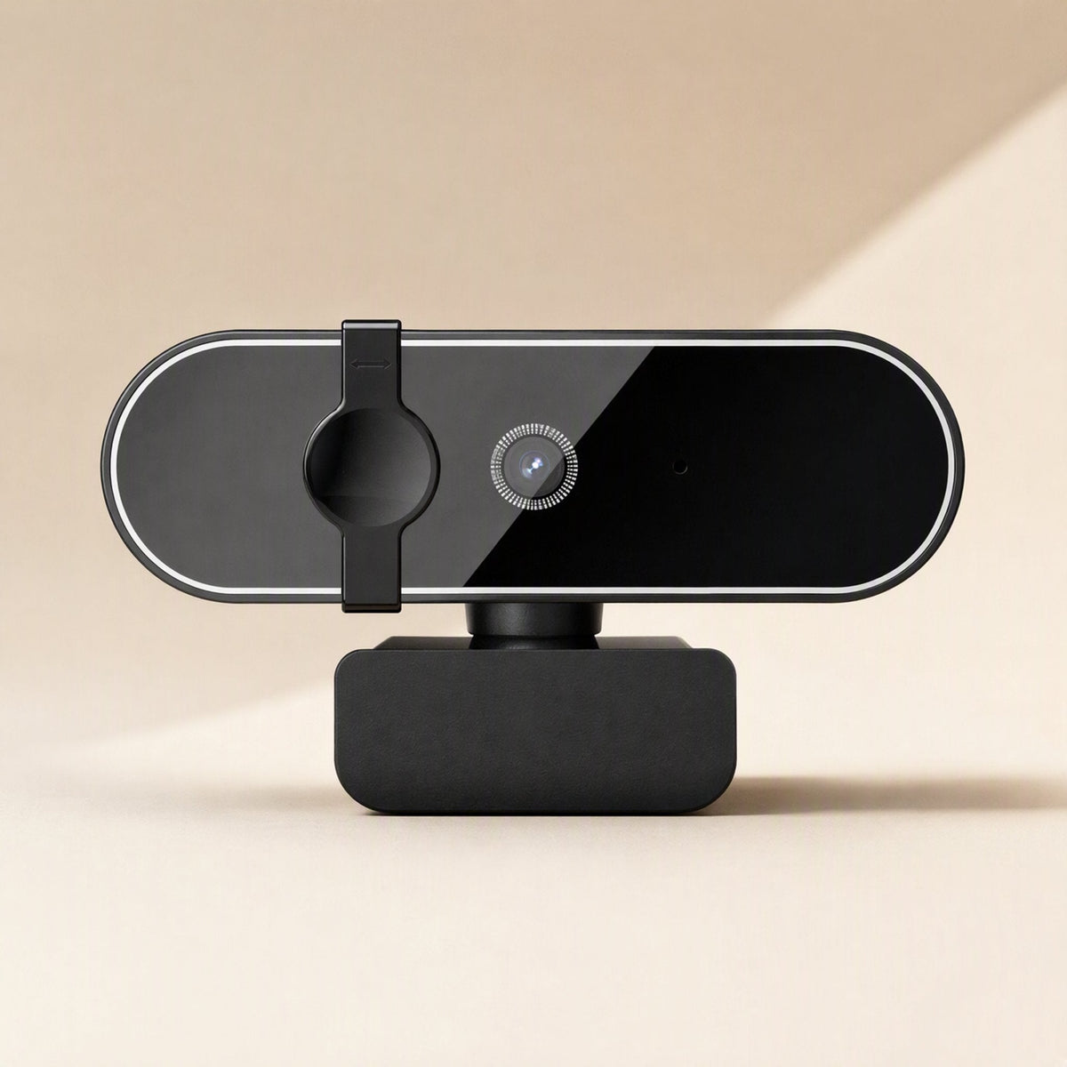 Soundglance – Black webcam front view, privacy cover over the lens, small microphone hole, on a clay-like stand against beige