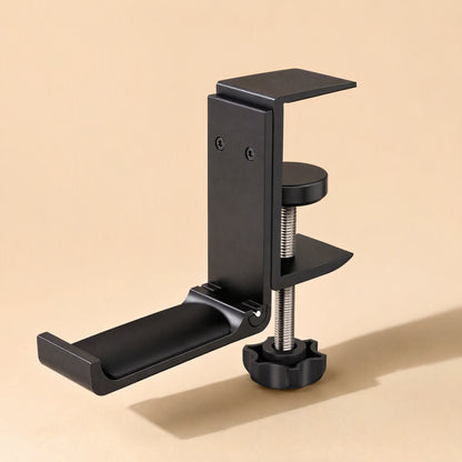 Alloyperch – Black clamp-style headphone stand angled from the side, showing screw knob and folded cradle arm