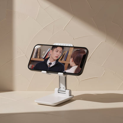 Foldprop – Phone stand holding a smartphone in landscape showing a video of two people talking in a library